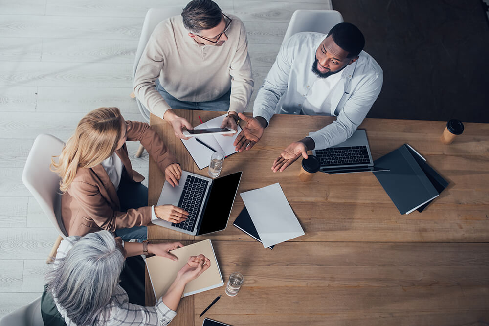 Multinational colleagues working in office